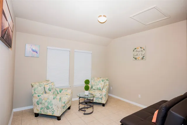 a living room with furniture and a couch
