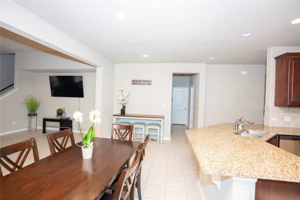 a living room with furniture wooden floor and a flat screen tv