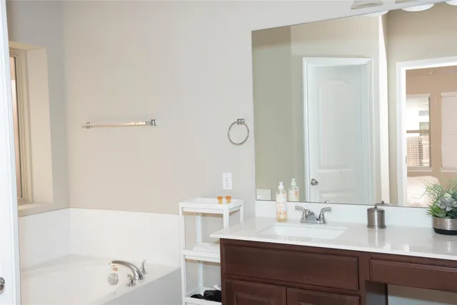 a bathroom with a sink and a bathtub