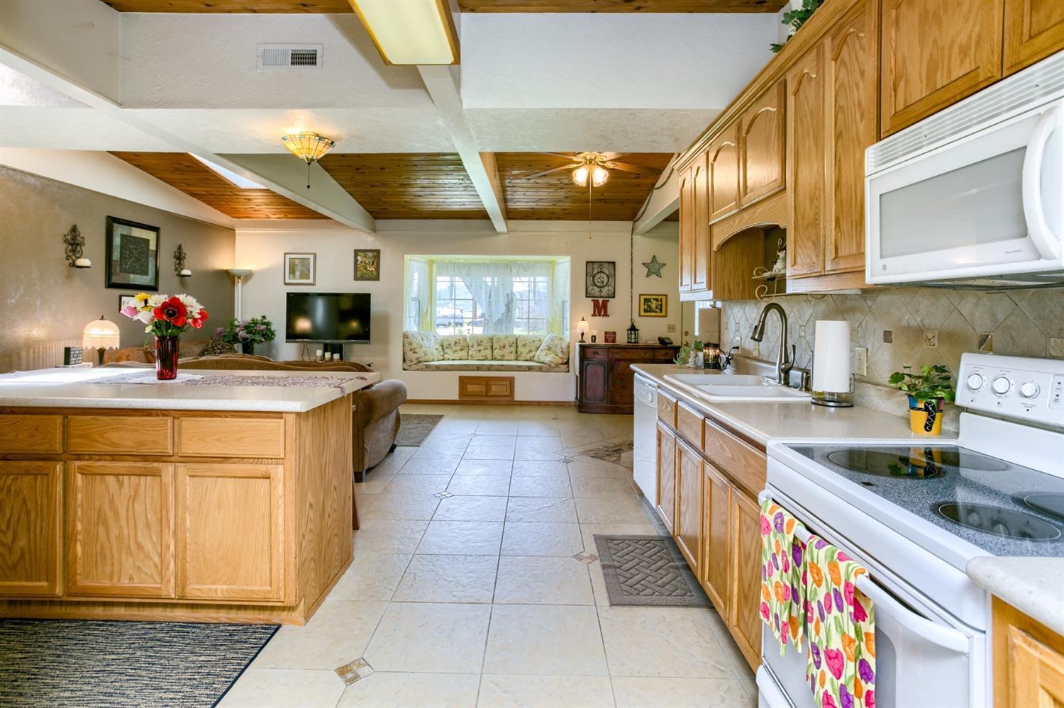 2777 East Antelope Road Eagle Point, OR 97524 - Photo 23 of 35 a large kitchen with stainless steel appliances kitchen island granite countertop a large counter top cabinets and a sink