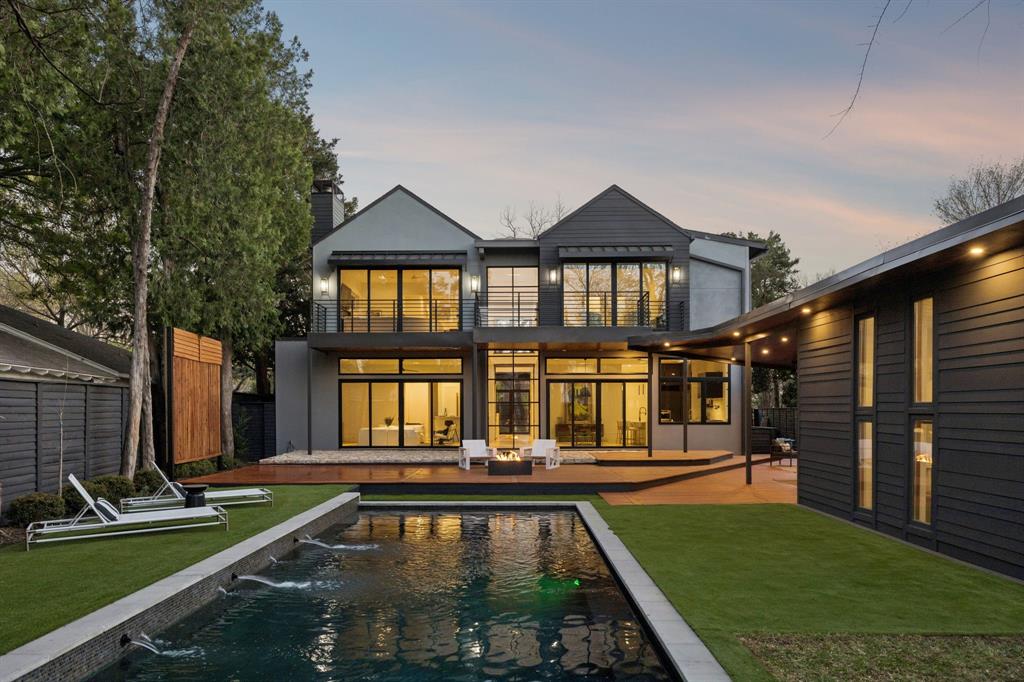 Clean lined modern design opens to a private backyard retreat with pool, expansive glass, and seamless indoor outdoor flow. Thoughtfully designed for both everyday living and entertaining, with warm natural light throughout and a separate guest or cabana space for added flexibility.