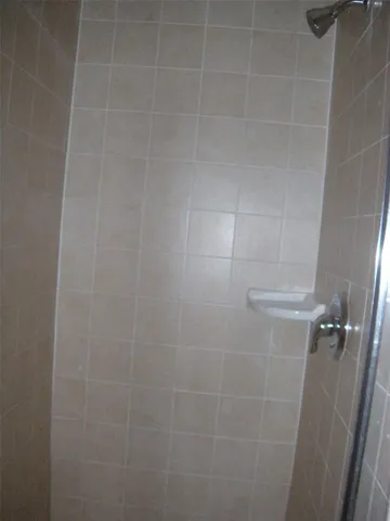 a view of bathroom with sink and mirror