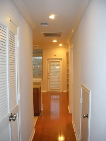 a bathroom with a glass door shower and closet