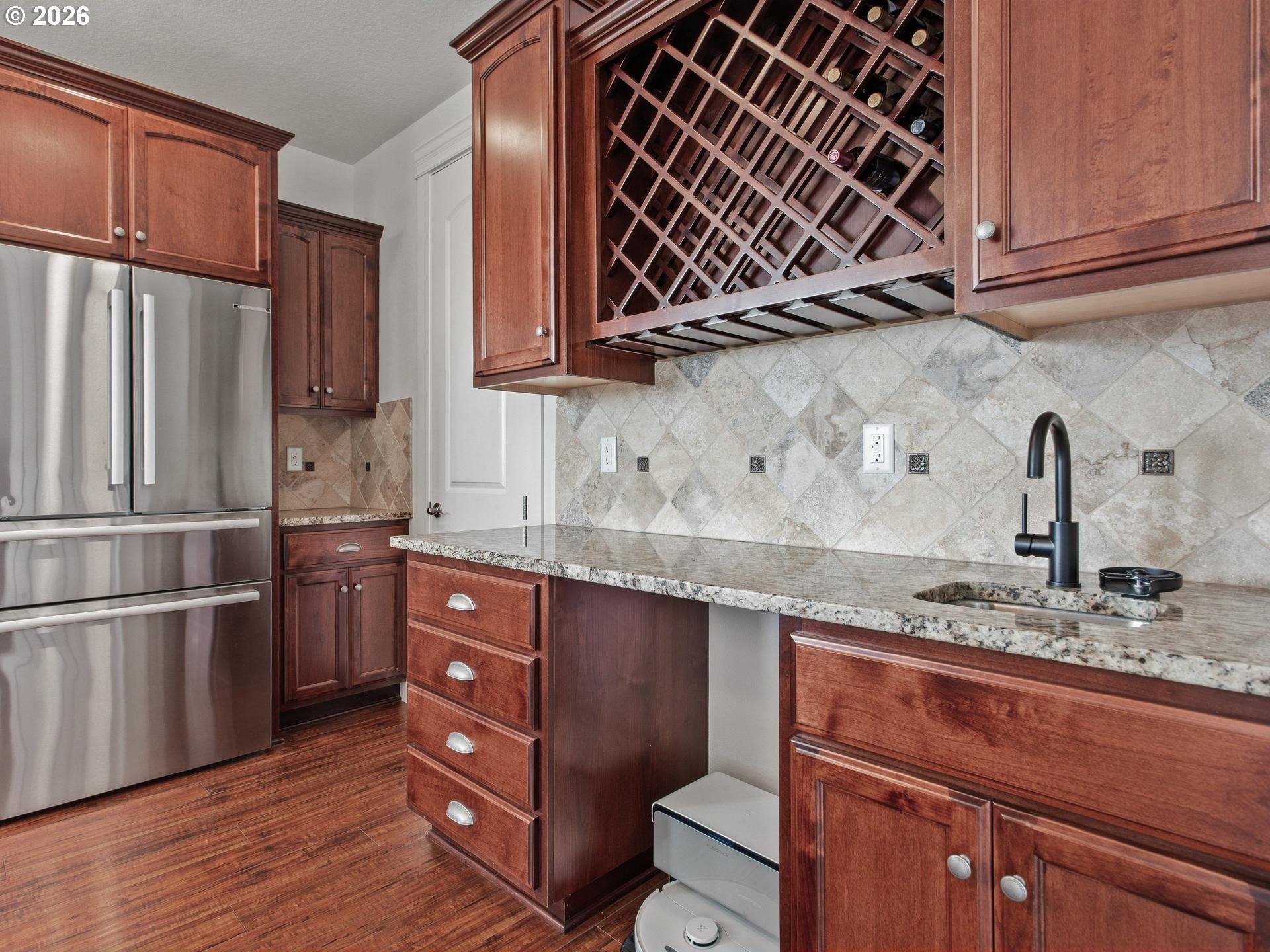 1012 Northwest Goodwin Street Camas, WA 98607 - Photo 8 of 44 a kitchen with stainless steel appliances granite countertop a sink stove and refrigerator
