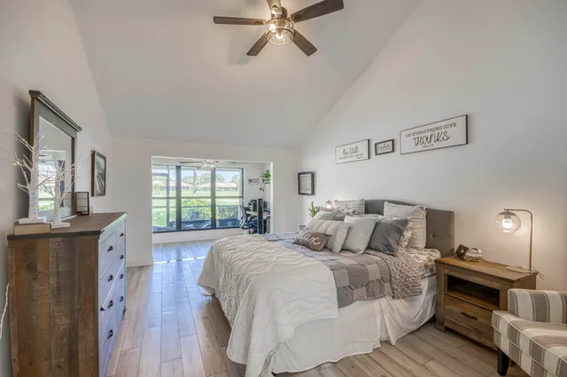 a bedroom with a large bed and a window