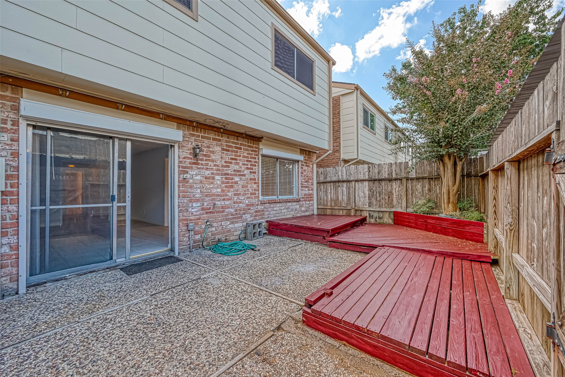 14179 Misty Meadow Lane Houston, TX 77079 - Photo 39 of 41 a view of backyard with a patio and wooden floor