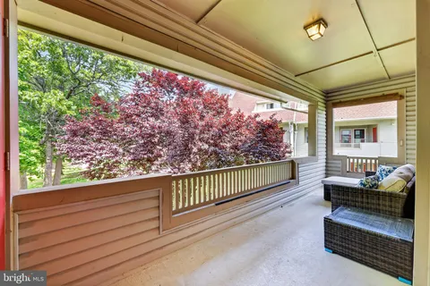 a view of a porch with furniture