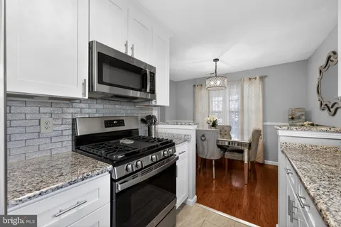a kitchen with a stove and a microwave