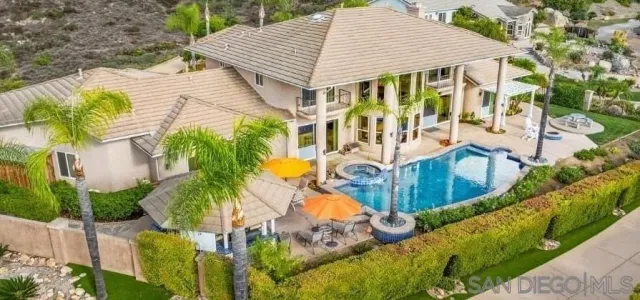 a outdoor living space with furniture granite floor and a view of kitchen