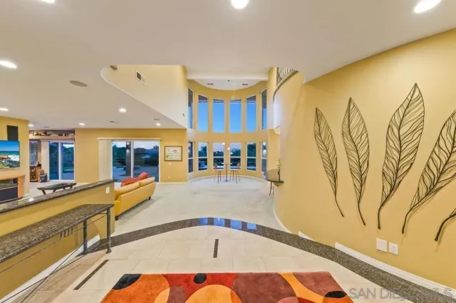 a room with table tennis pool table and chairs