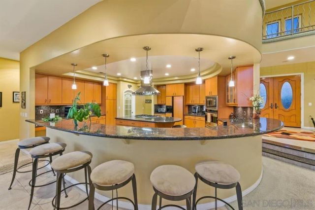 a spacious bathroom with a double vanity sink a mirror and a bathtub
