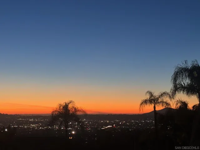 a view of a house with pool porch and sitting area