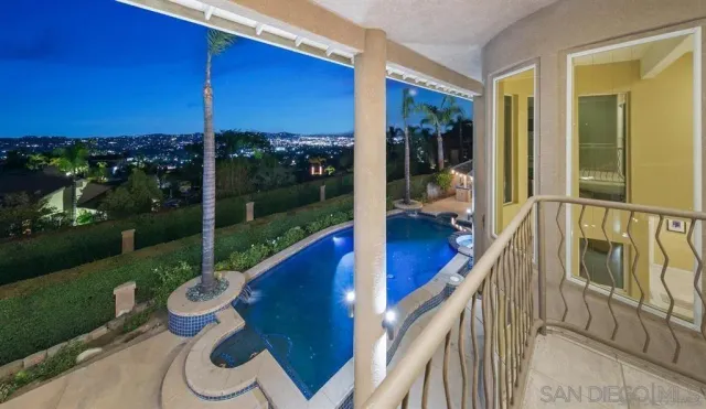 a view of swimming pool from a lake view