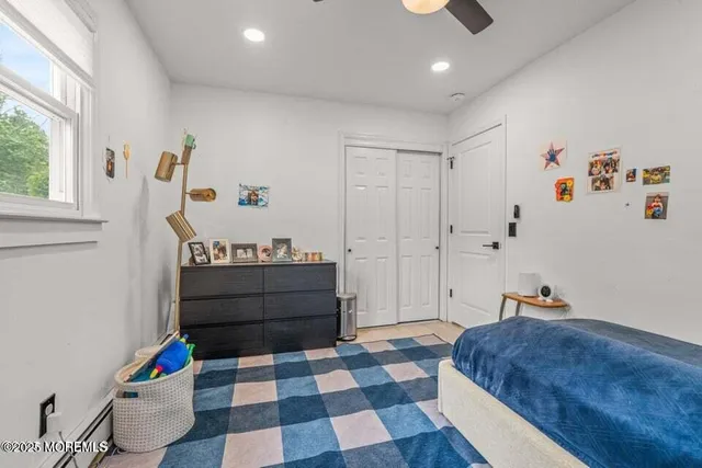 a room with a dresser and a window