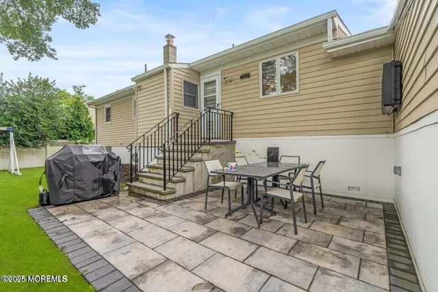 a blue bench sitting in front of a house