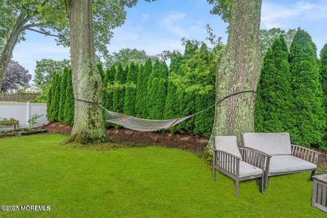 an outdoor sitting area with golf course