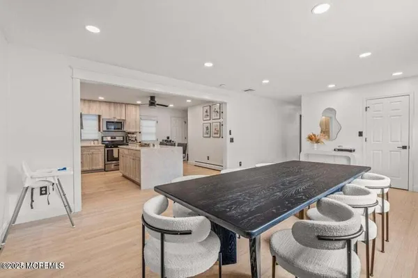a kitchen with a table and chairs in it