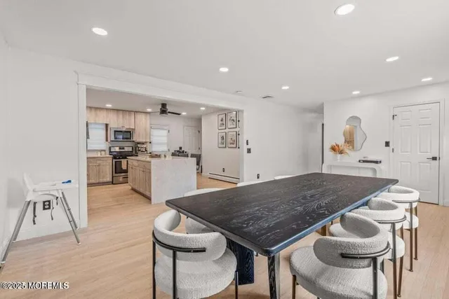 a kitchen with a table and chairs in it