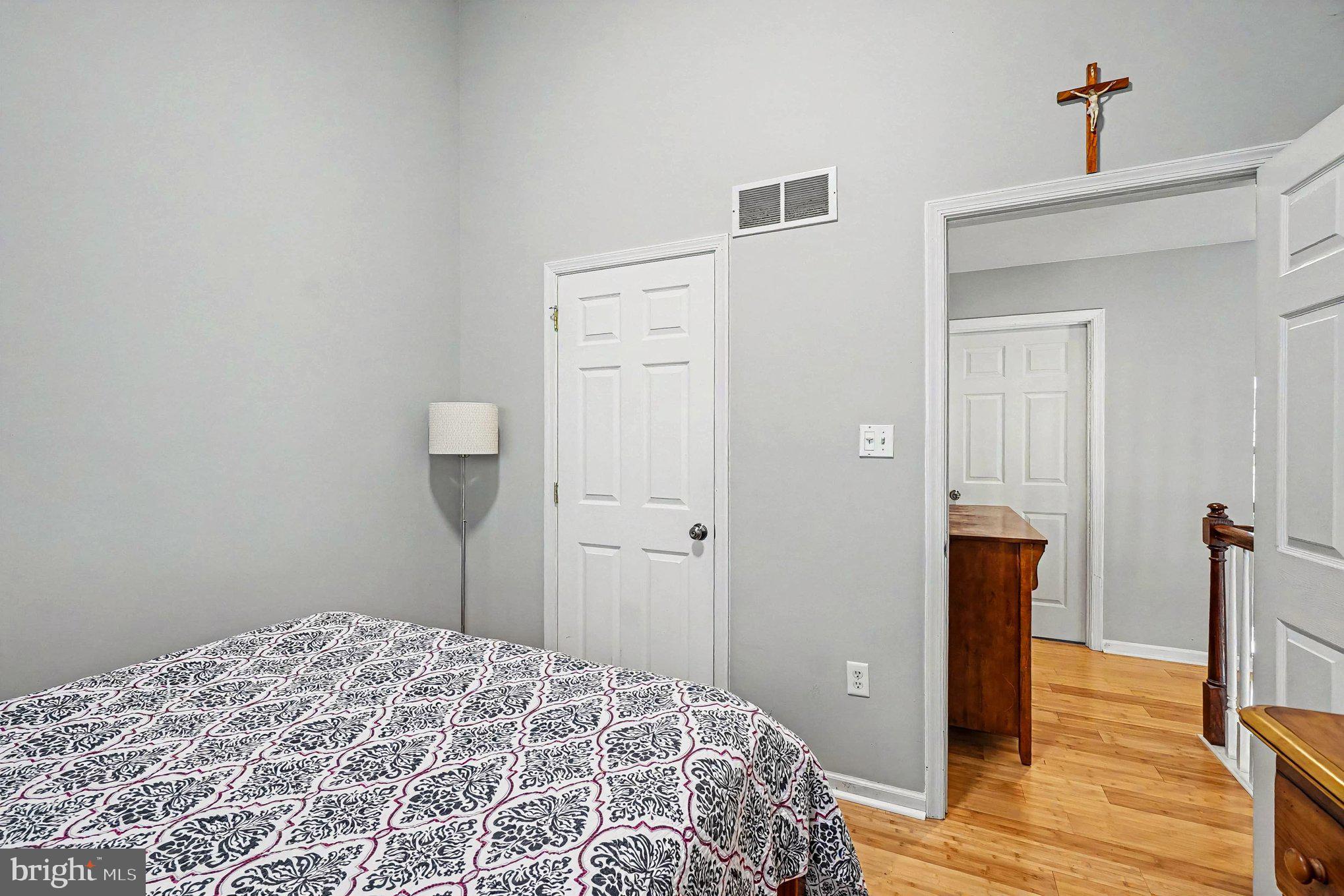 64 Open Meadow Court Elkton, MD 21921 - Photo 24 of 57 a bedroom with a bed and wooden floor