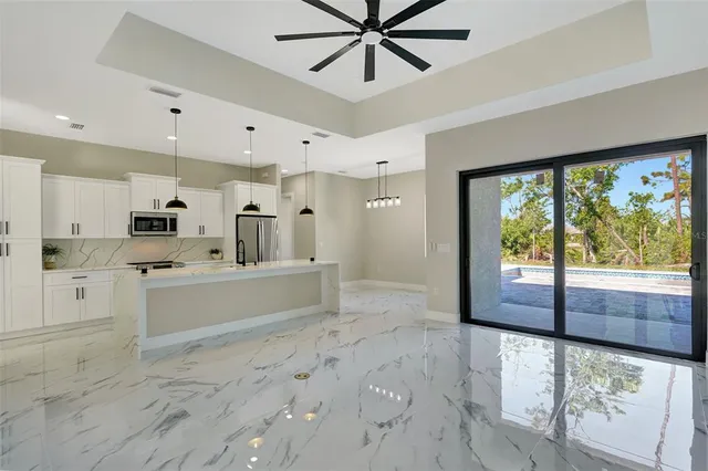 a bathroom with a double vanity sink mirror and shower