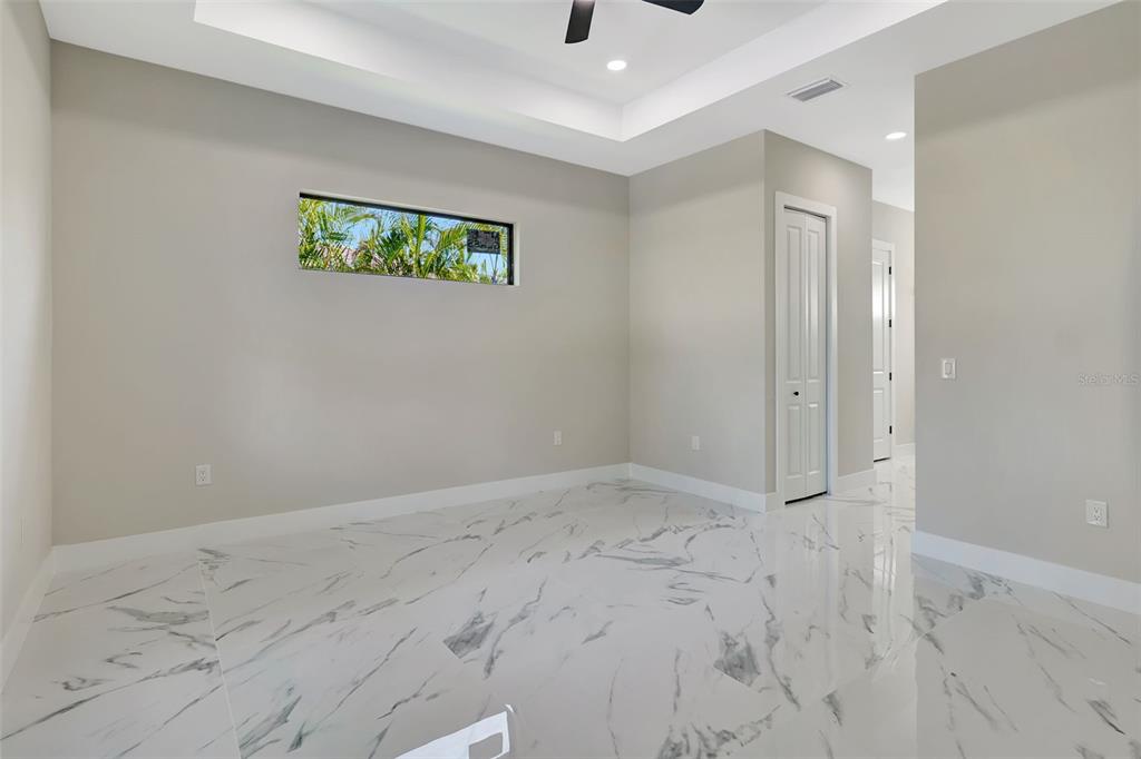 212 Fairway Road Rotonda West, FL 33947 - Photo 22 of 65 a view of an empty room with a window