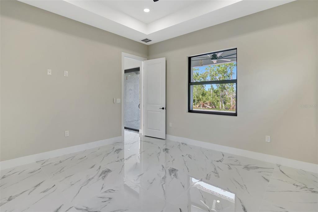 212 Fairway Road Rotonda West, FL 33947 - Photo 24 of 65 an empty room with windows