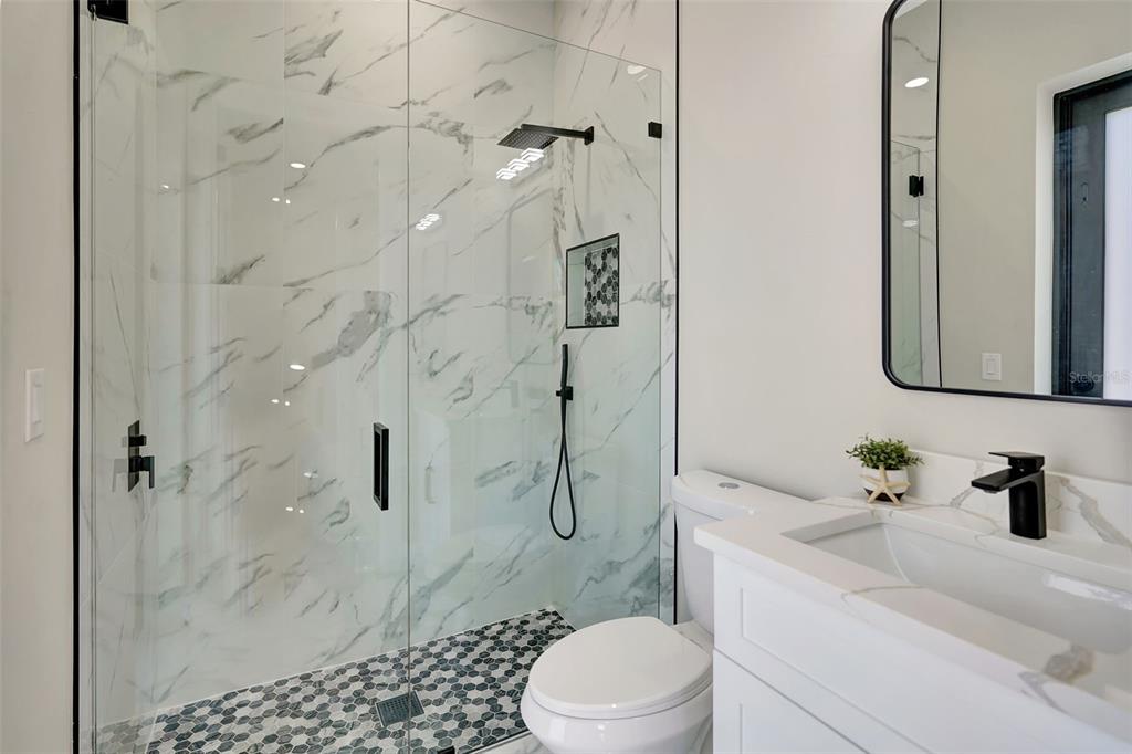 212 Fairway Road Rotonda West, FL 33947 - Photo 34 of 65 a bathroom with a sink toilet and shower