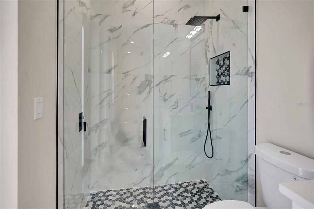 212 Fairway Road Rotonda West, FL 33947 - Photo 35 of 65 a bathroom with a shower