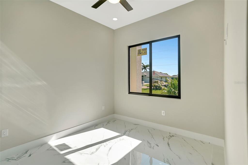 212 Fairway Road Rotonda West, FL 33947 - Photo 40 of 65 an empty room with windows