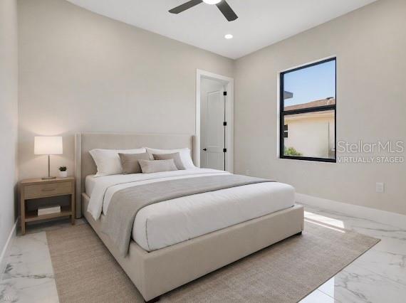 212 Fairway Road Rotonda West, FL 33947 - Photo 41 of 65 a bedroom with a bed and a painting