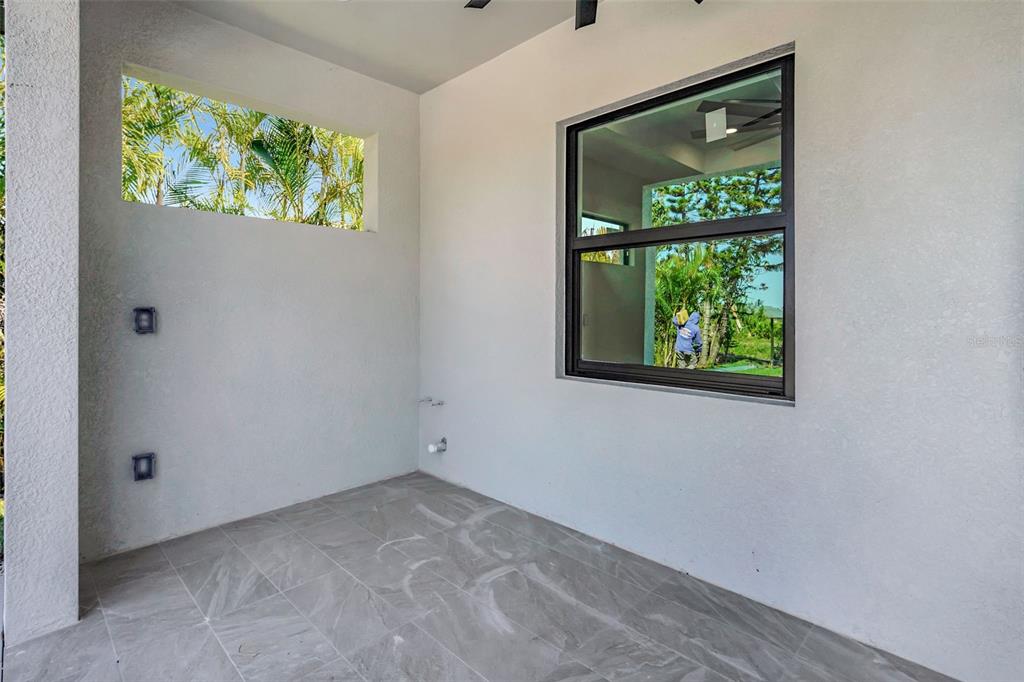 212 Fairway Road Rotonda West, FL 33947 - Photo 53 of 65 an empty room with a window