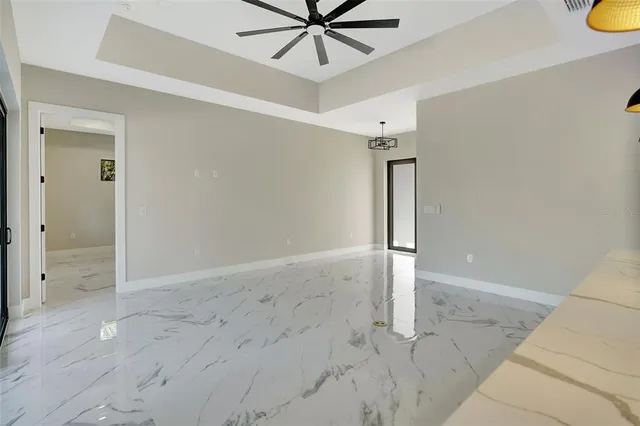 a kitchen with a sink and a chandelier