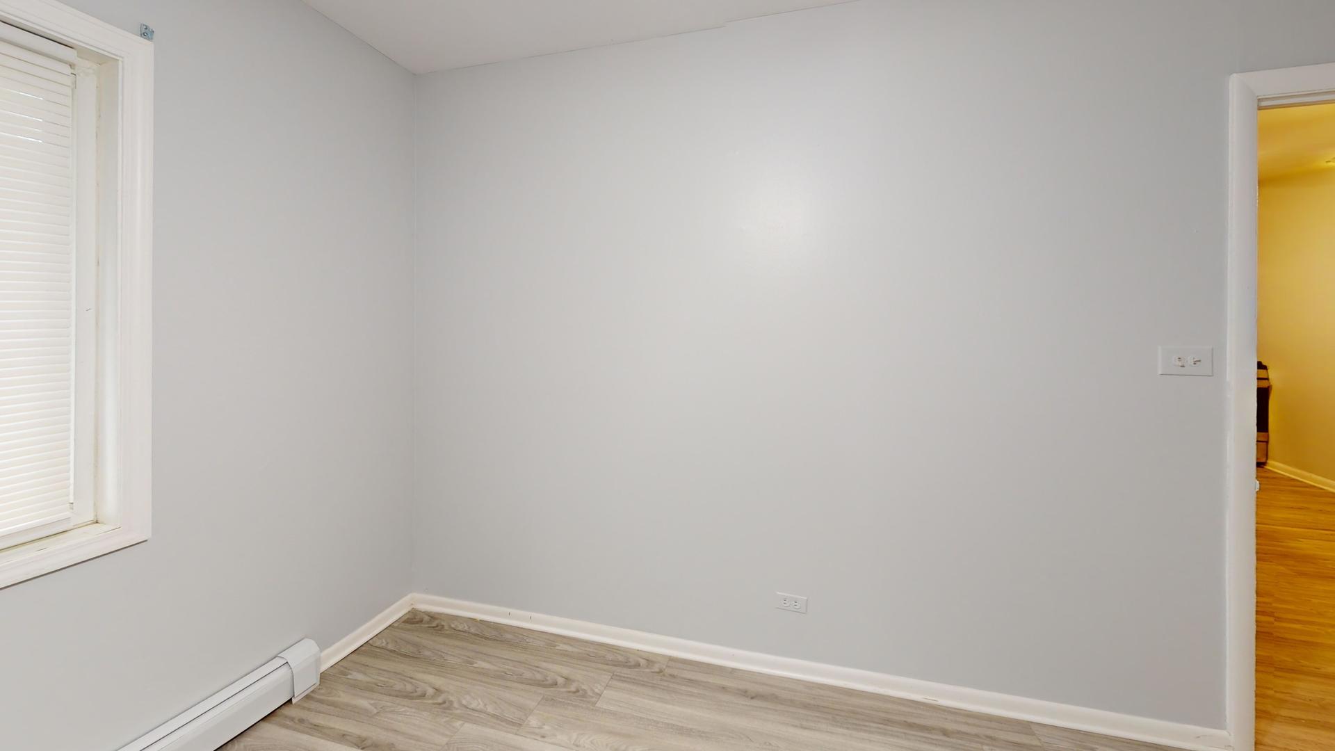 501 Chicago Road, Unit 11 Thornton, IL 60476 - Photo 6 of 8 a view of a small space with wooden floor