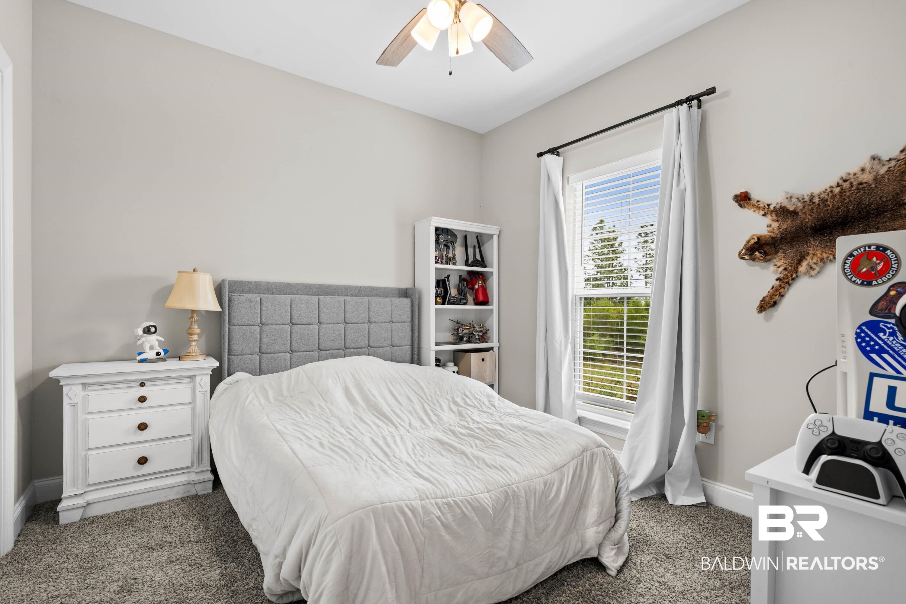 7150 Powell Road, Unit LOT 6A Eight Mile, AL 36613 - Photo 16 of 35 Bedroom with carpet and ceiling fan