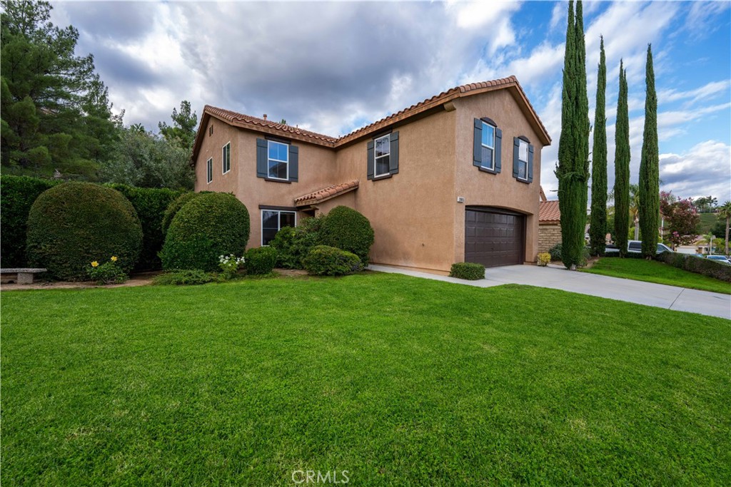 29915 Shadow Place Castaic, CA 91384 - Photo 1 of 1 a front view of a house with a yard and garage
