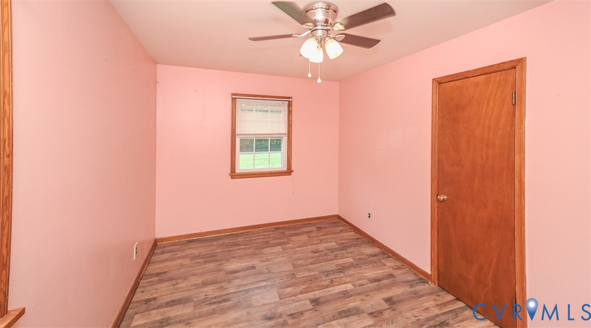 581 Smokey Road Aylett, VA 23009 - Photo 22 of 28 Room featuring wood-finish flooring, a window with