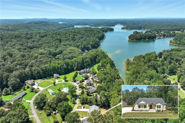 an aerial view of a houses with a yard