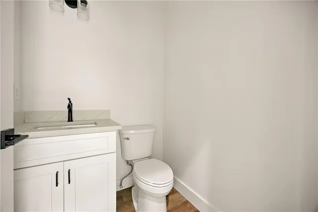 a bathroom with a toilet and a sink