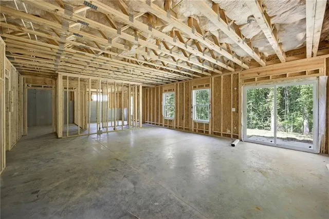 a view of an empty room with windows