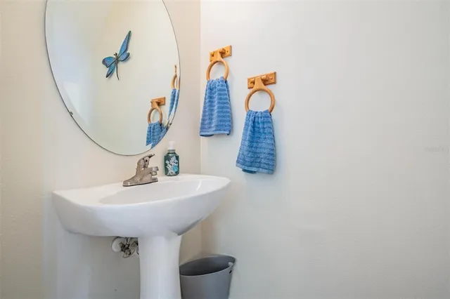 a bathroom with a sink and mirror
