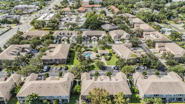 an aerial view of residential houses with outdoor space