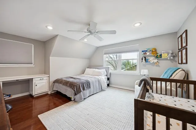 a bedroom with furniture and a window