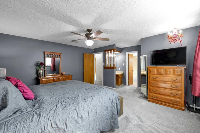 a bedroom with a bed and furniture