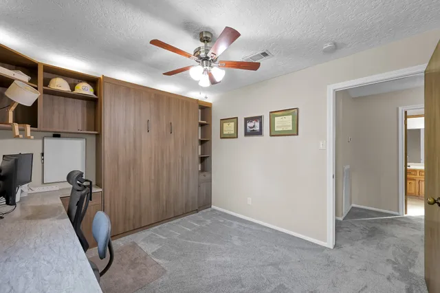 a view of a livingroom with a workspace
