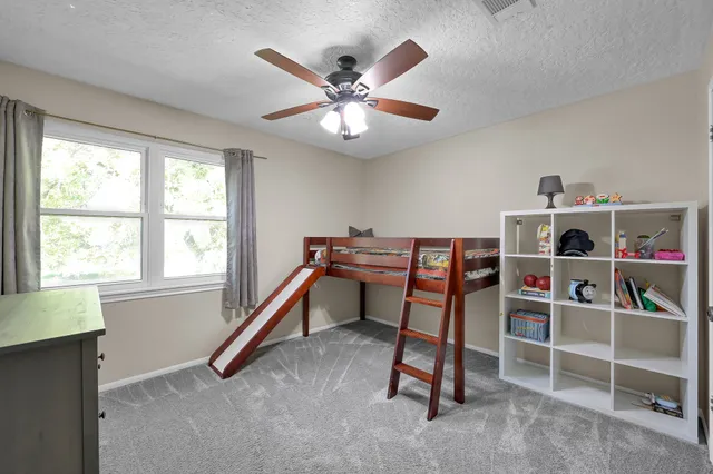 a work room with furniture and a window