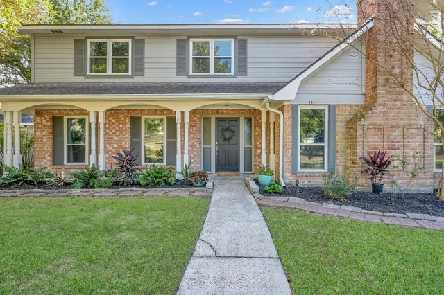 a front view of a house with garden