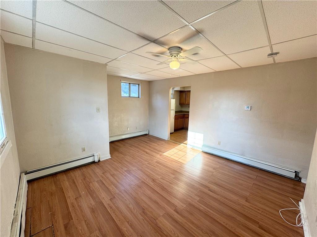 340 Rochelle Street, Unit 1 Pittsburgh, PA 15210 - Photo 5 of 5 a view of an empty room with wooden floor