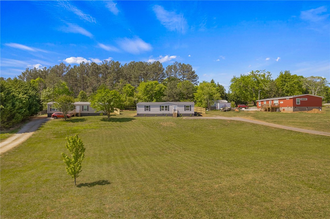 375 Griggs Road Six Mile, SC 29682 - Photo 29 of 36 Expansive green spaces surround these charming homes, offering tranquil rural living.