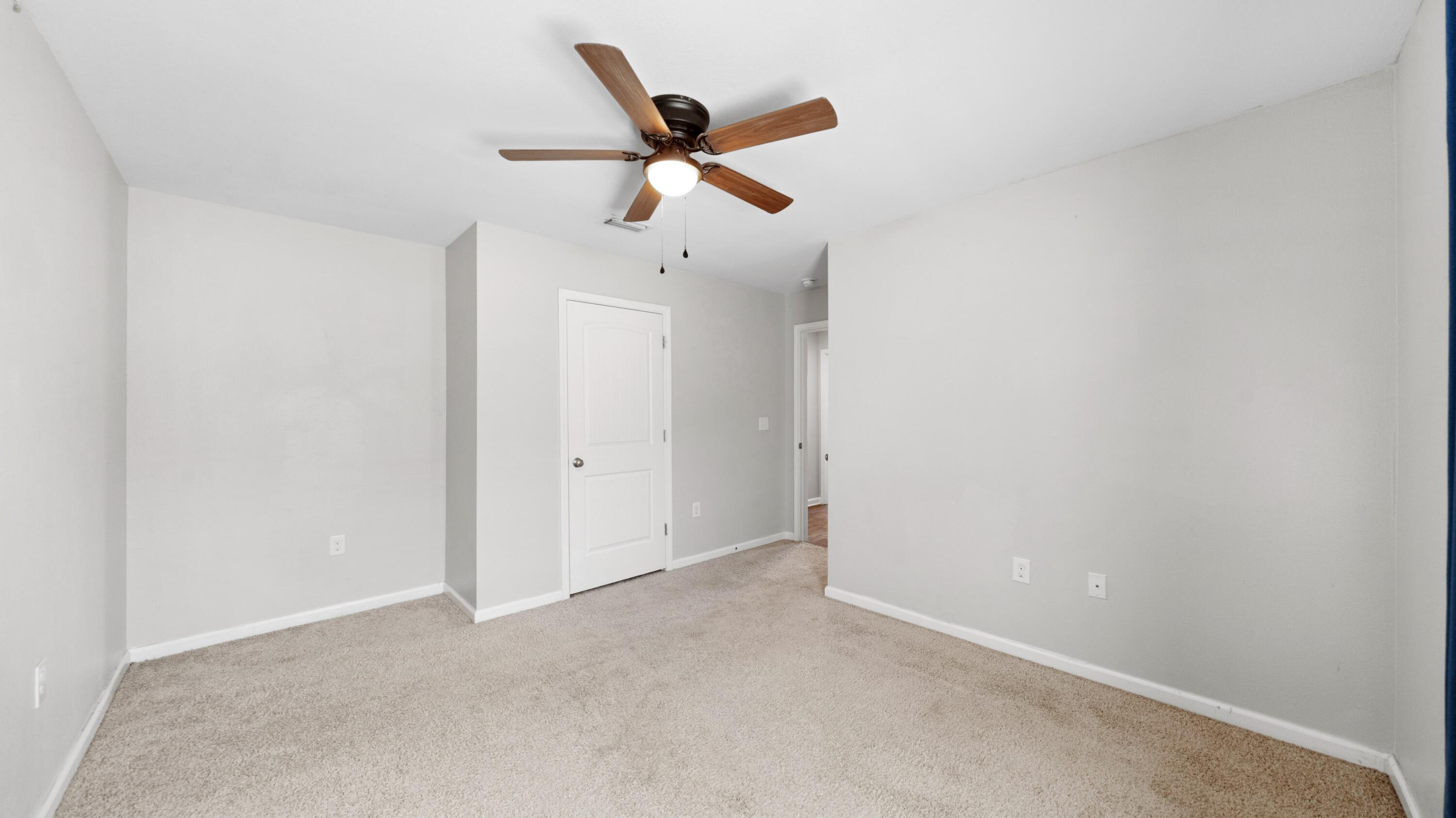 3927 Alva Thomas Road Panama City, FL 32404 - Photo 26 of 46 a view of room with ceiling fan