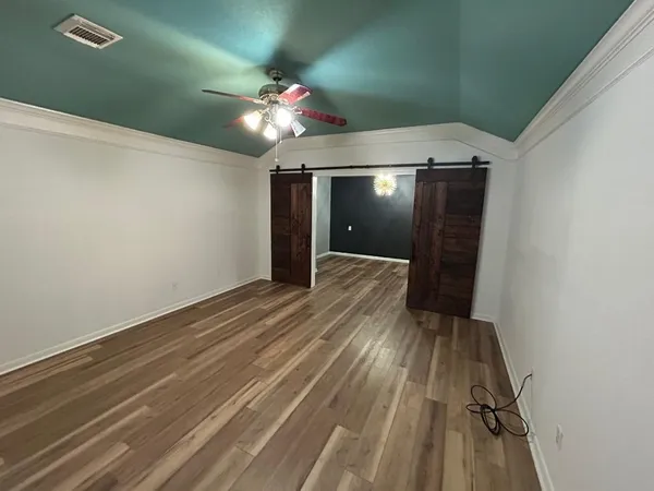 a view of gallery with wooden floor